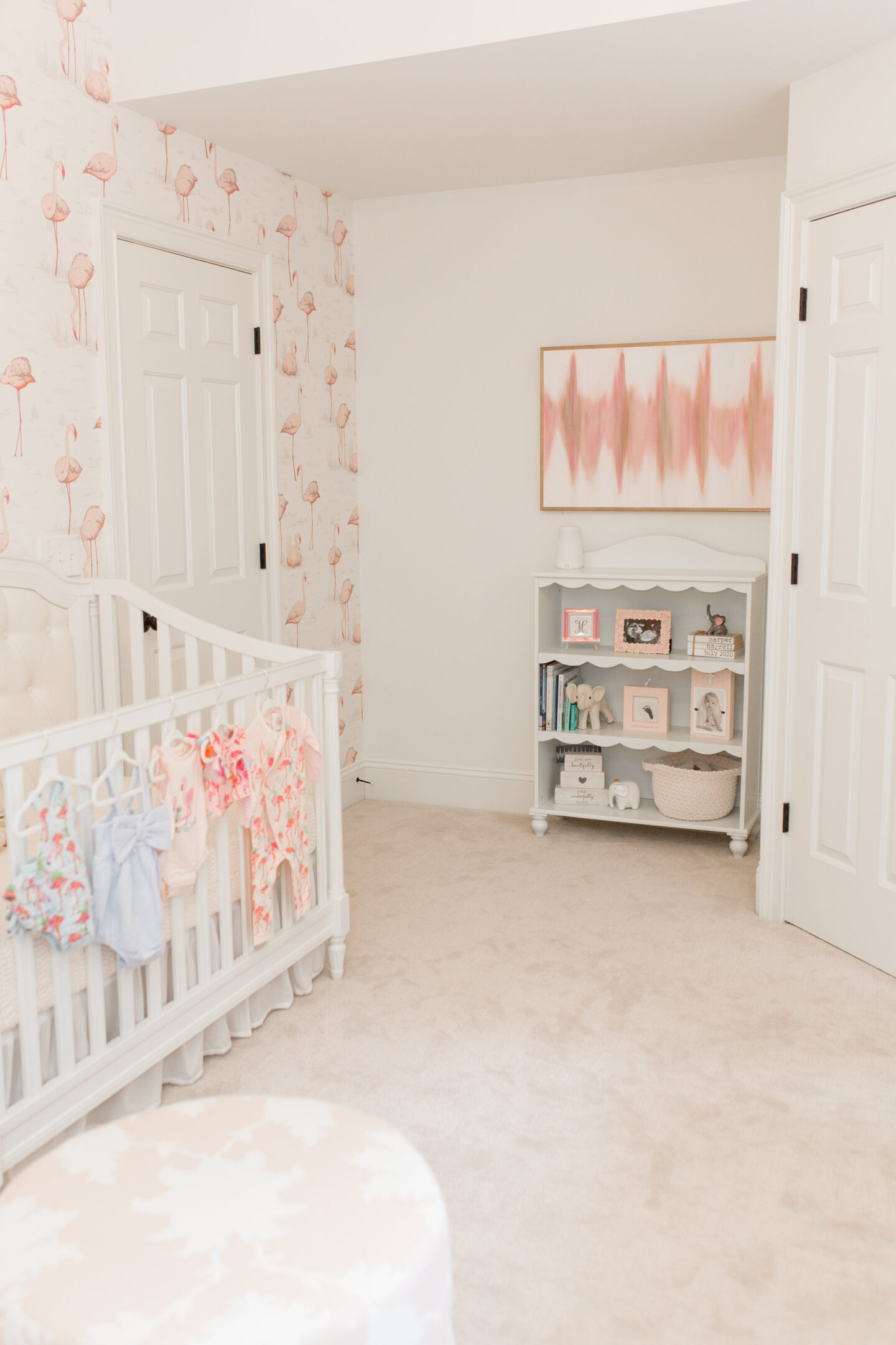 little girl pink and white nursery with flamingo wallpaper