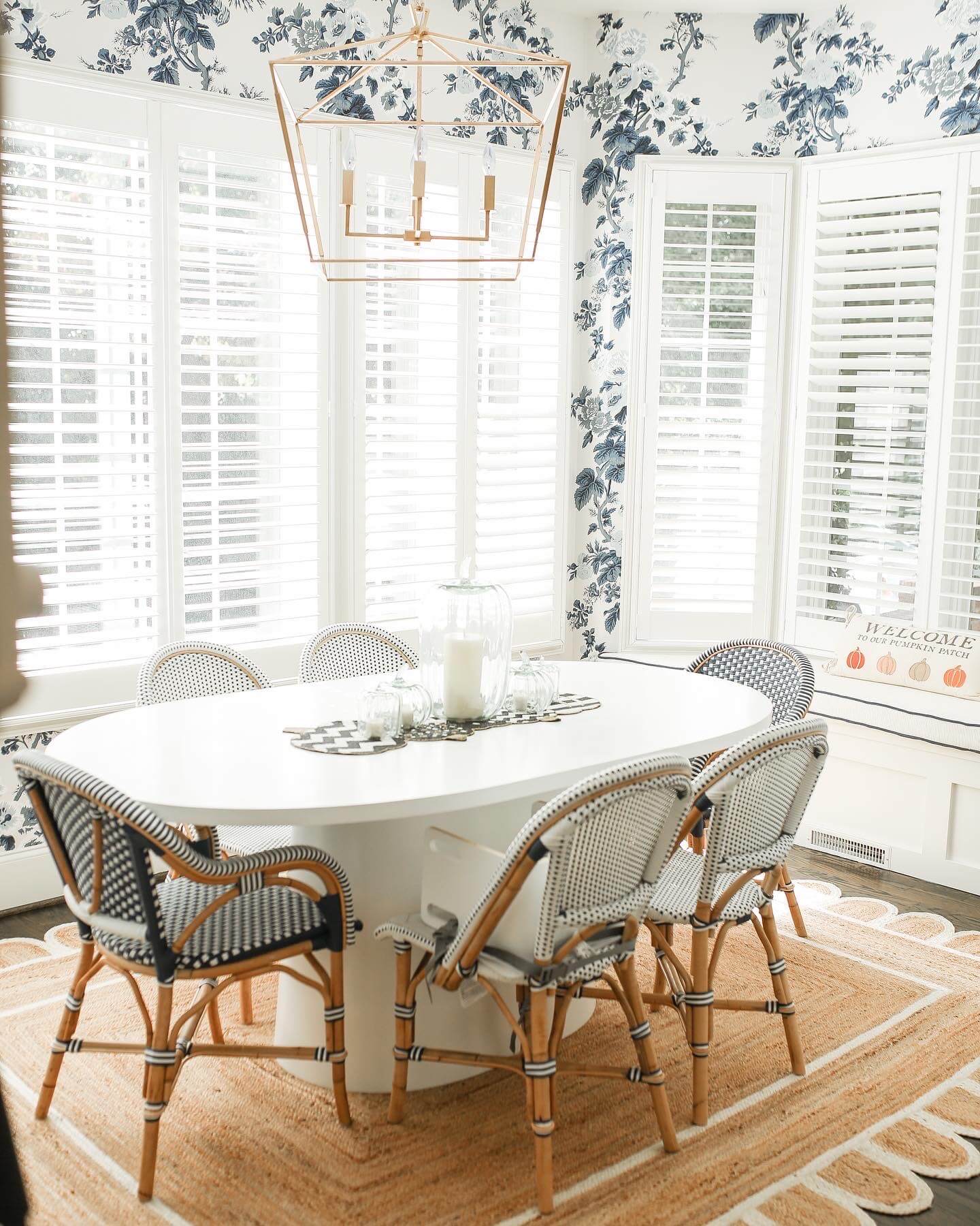 grandmillenial dining room with black and white mackenzie childs table runner