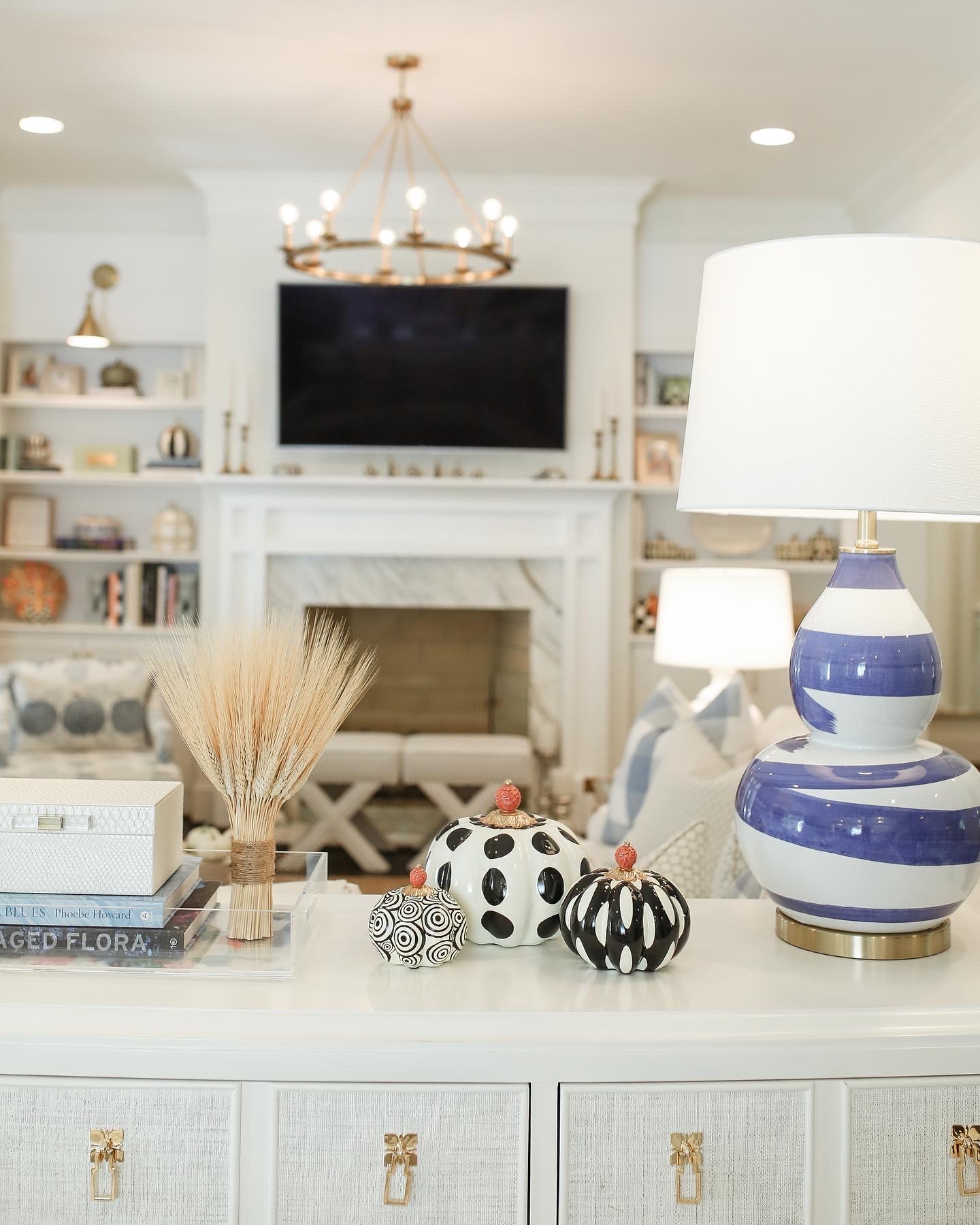 grandmillennial living room with white couch and fall decor