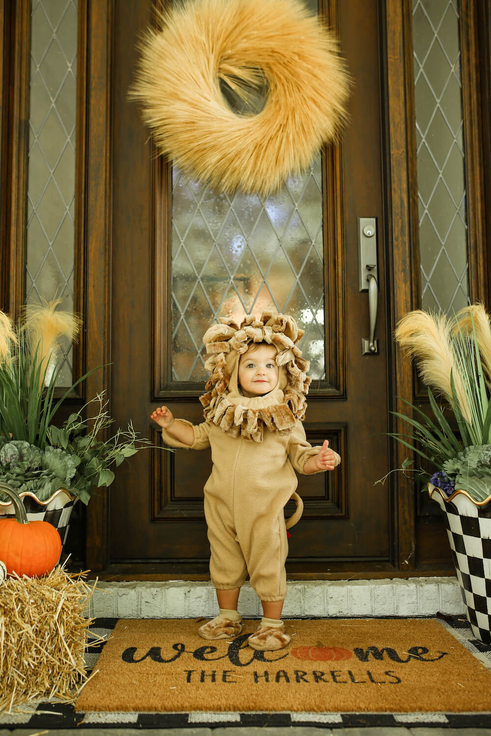 little girl on front porch in lion costume