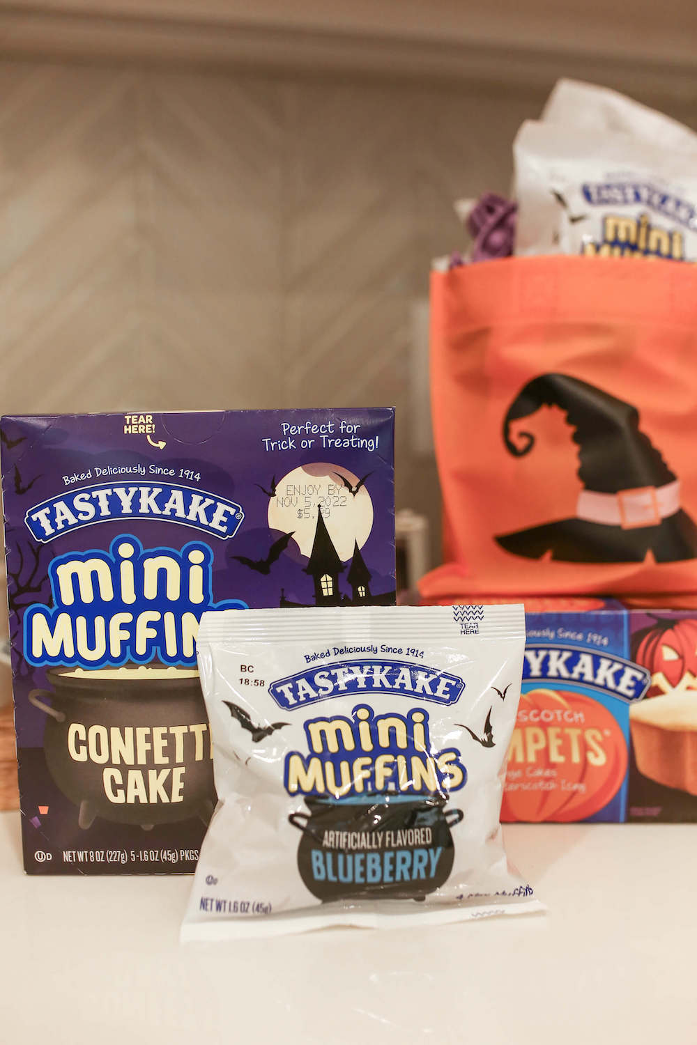 closeup of tastykake mini muffins and orange bags for Halloween