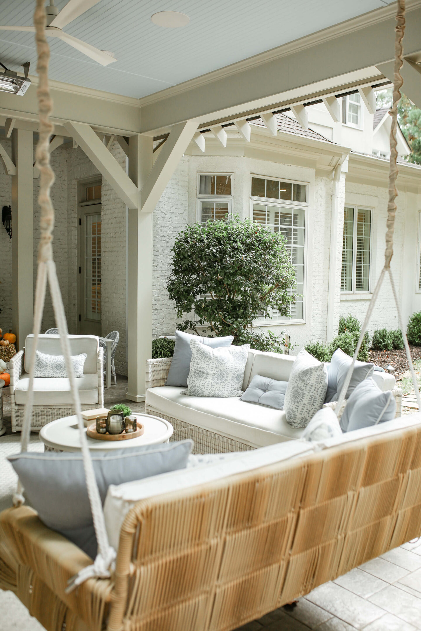 back patio with white brick exterior house