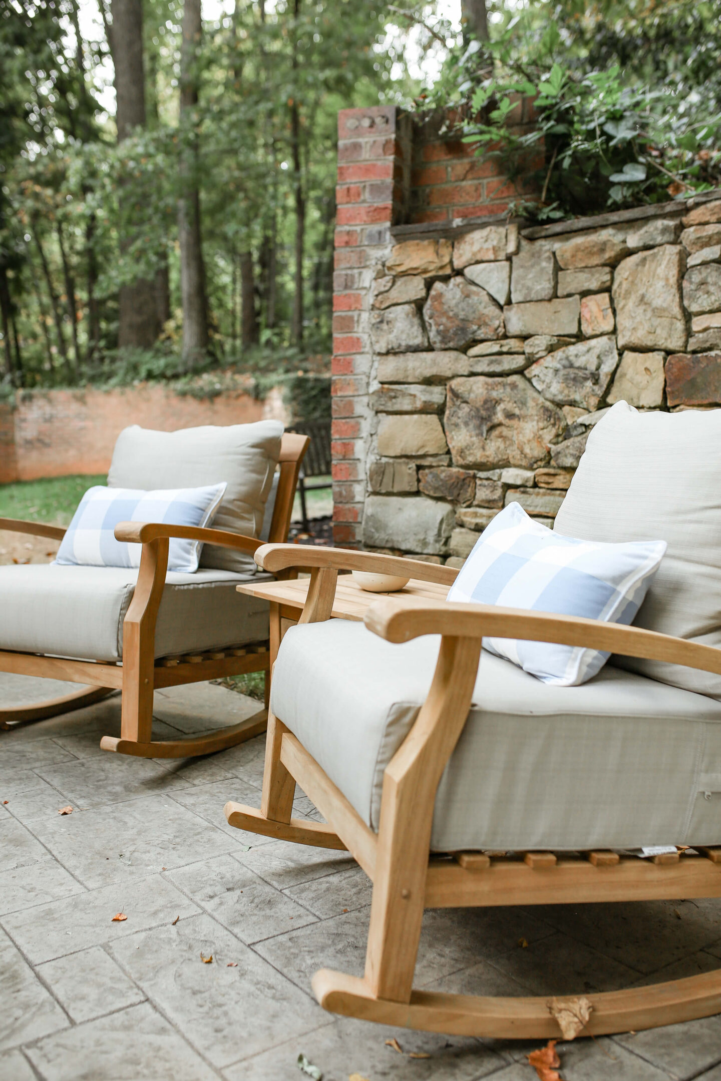 closeup of brown oversized outdoor chairs with white cushions