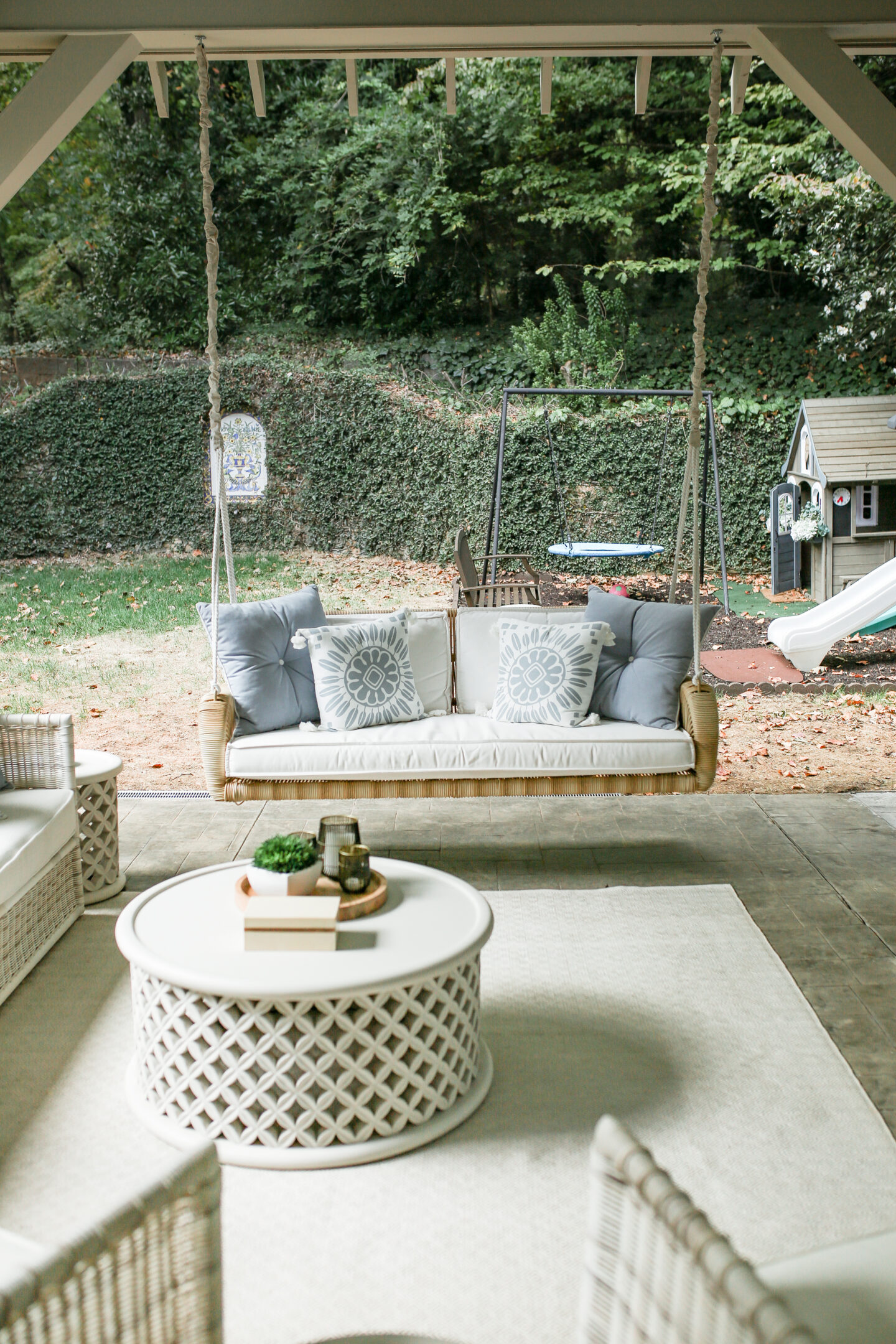serena and lily outdoor daybed with white cushions and white and blue pillows
