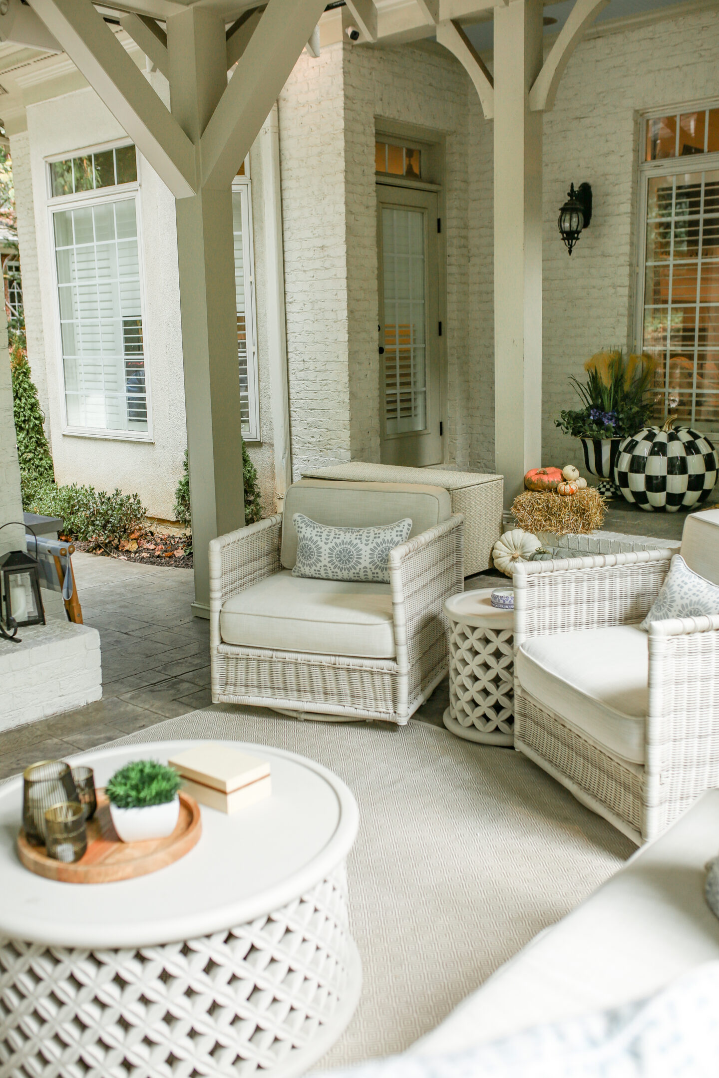 2 outdoor wicker chairs on back patio