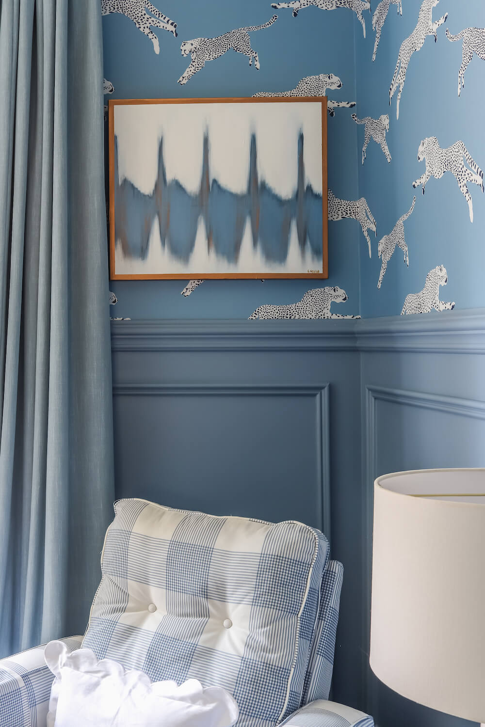 heartbeat print in the corner behind glider in nursery