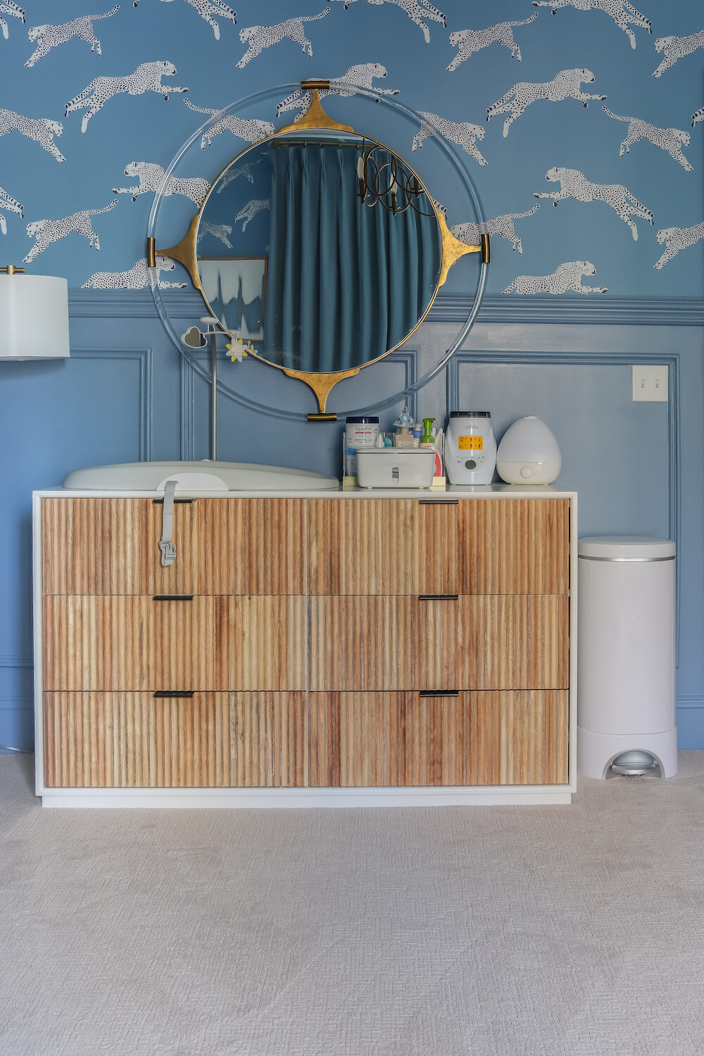 white dresser with wood fronts in front of benjamin moore denim wash walls