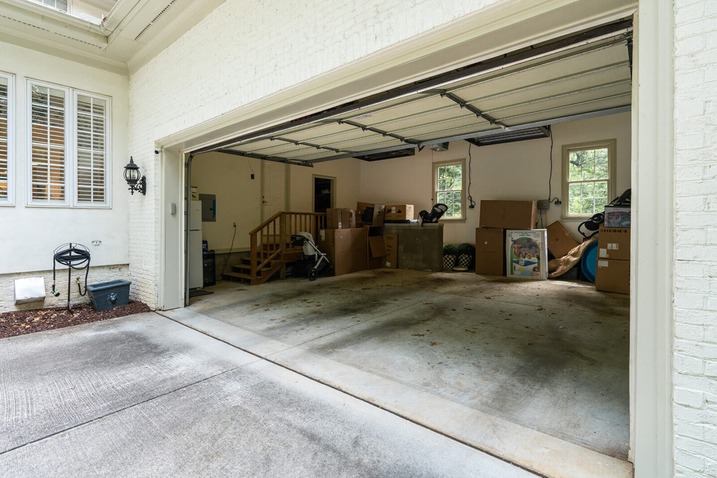 home garage makeover before with boxes stacked on sides