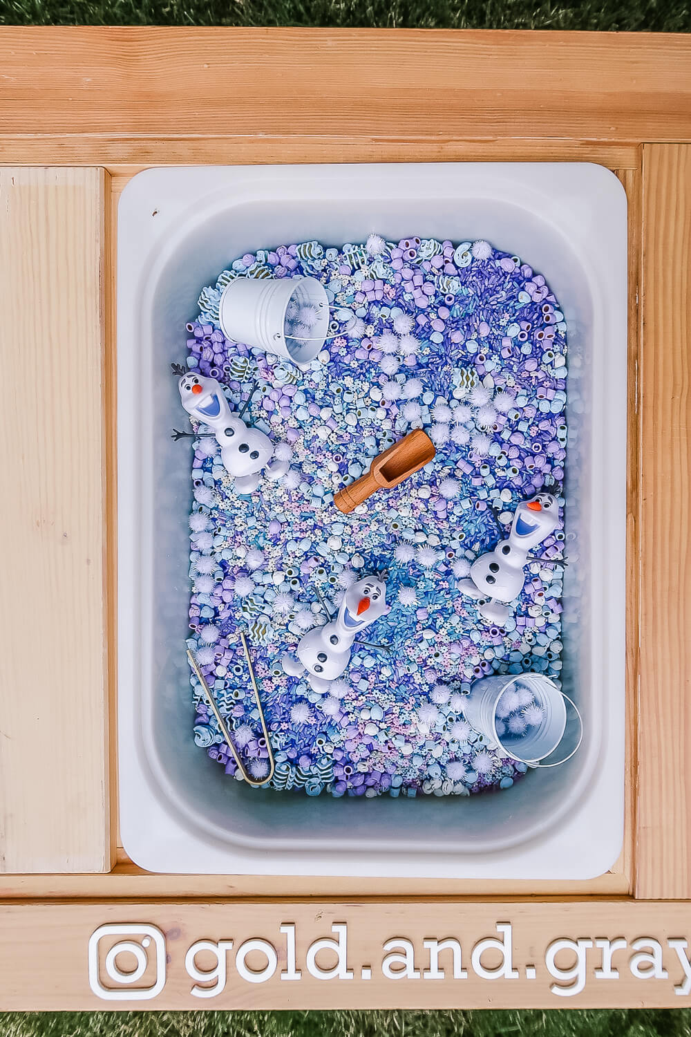 closeup of frozen themed sensory table with @gold.and.gray